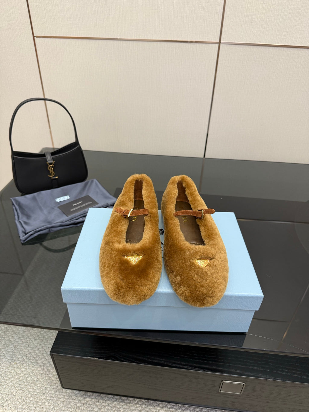 Women's tan suede flats with buckle strap and open toe cutout