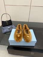 Women's tan suede flats with buckle strap and open toe cutout