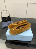 Women's tan suede flats with buckle strap, side view