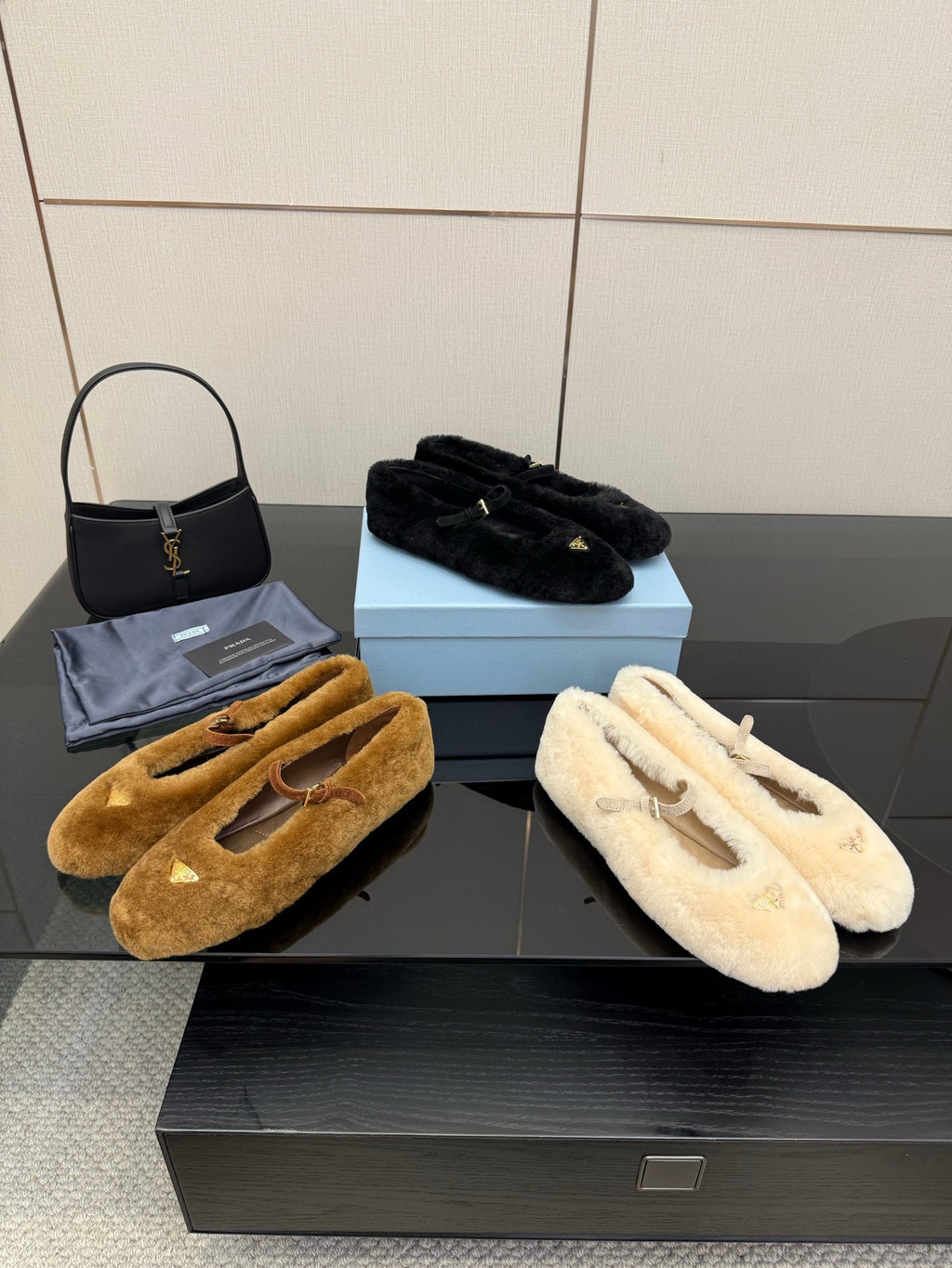 Women's flats in tan, cream, and black suede with buckle straps
