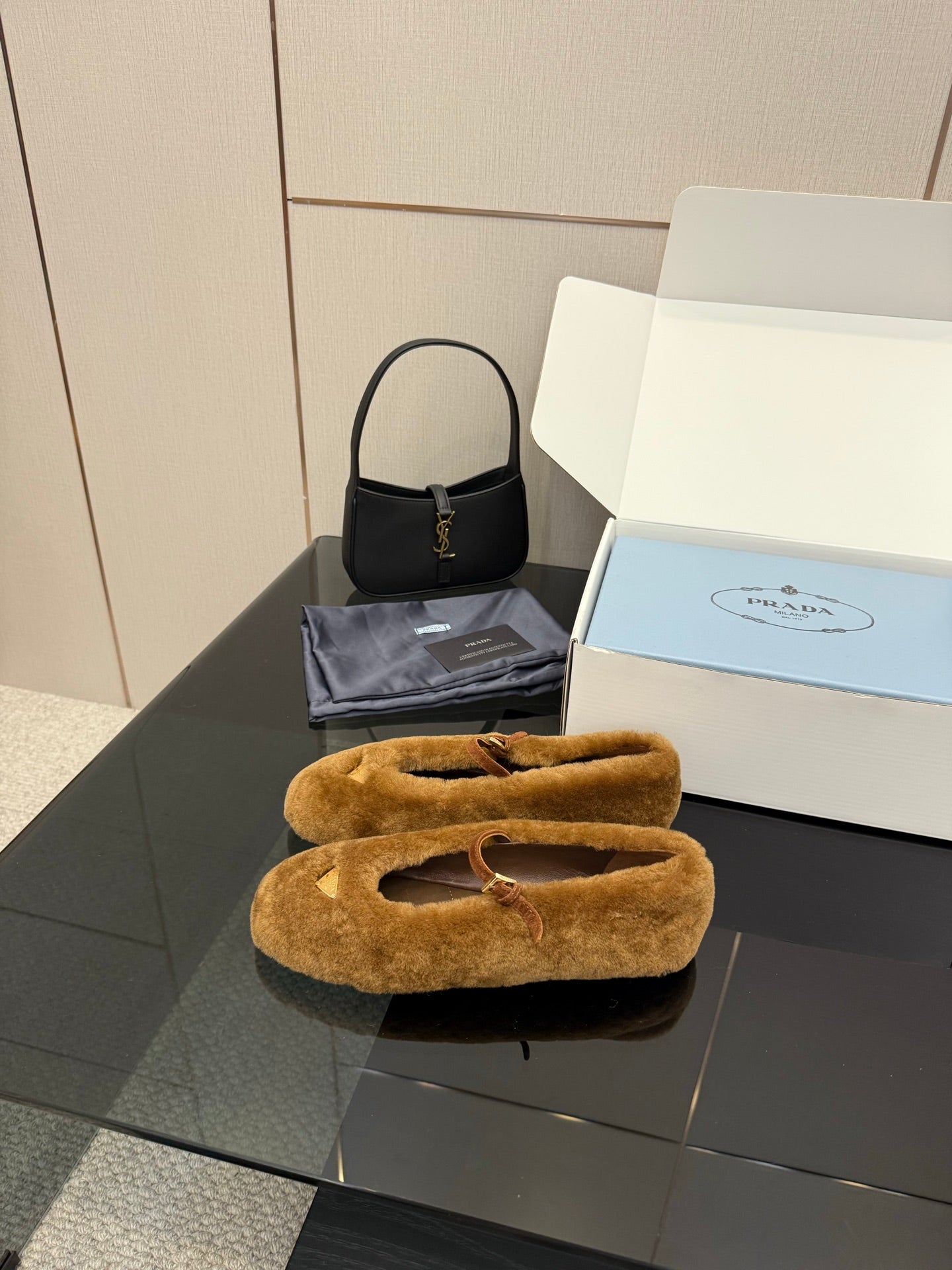 Women's tan suede flats with buckle strap, front view