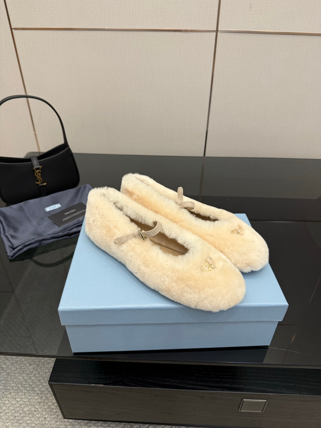 Prada ladies shearling loafers, cream plush slip-ons with gold top strap detail