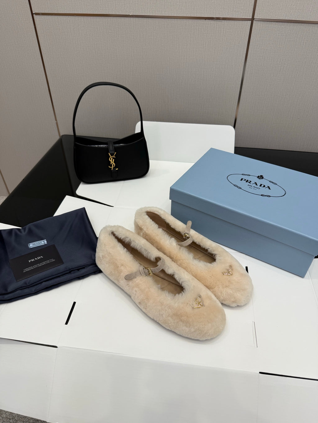 Prada ladies shearling loafers, cream slip-on loafers with gold bar ornament