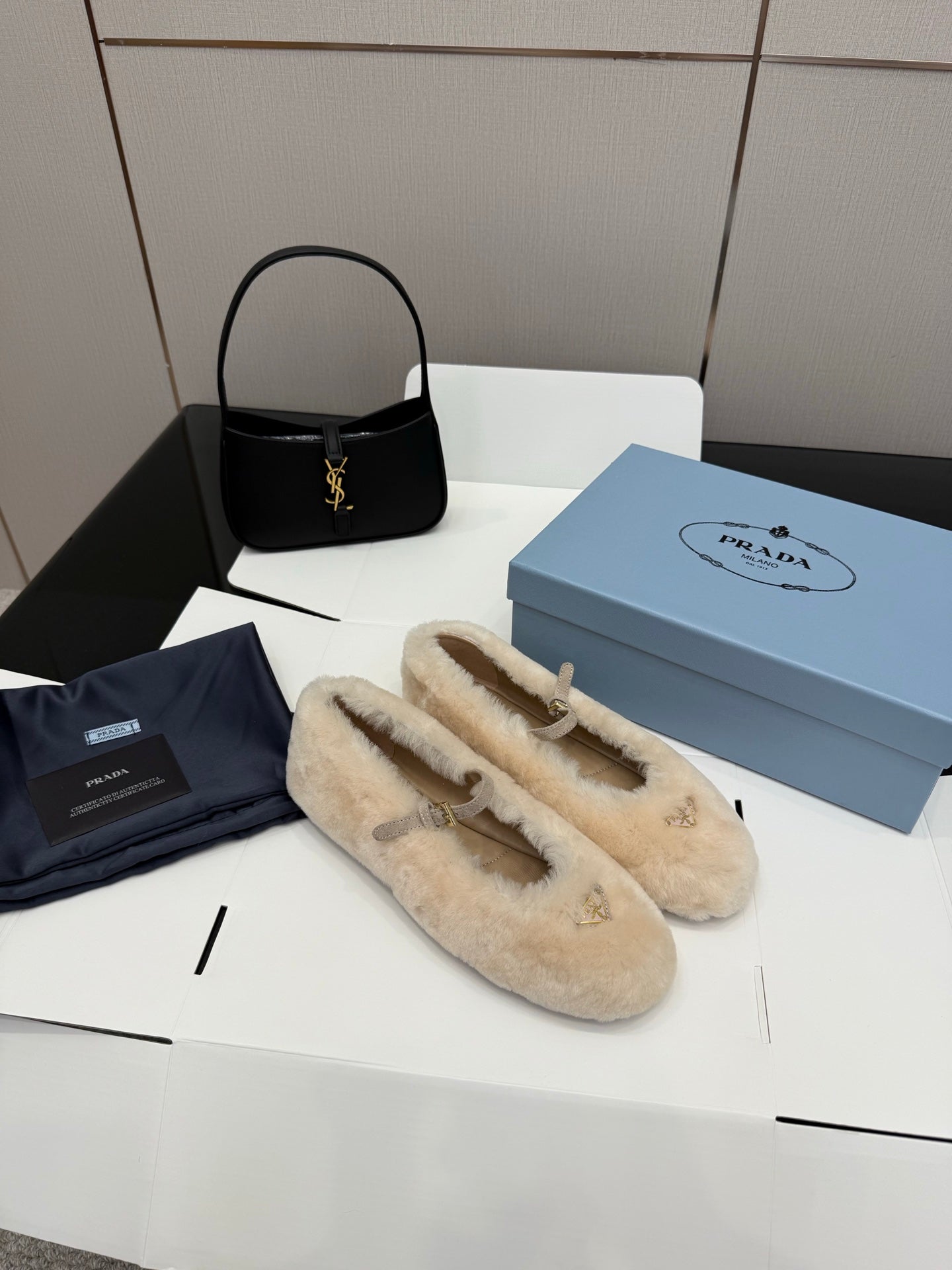 Prada ladies shearling loafers, cream slip-on loafers with gold bar ornament