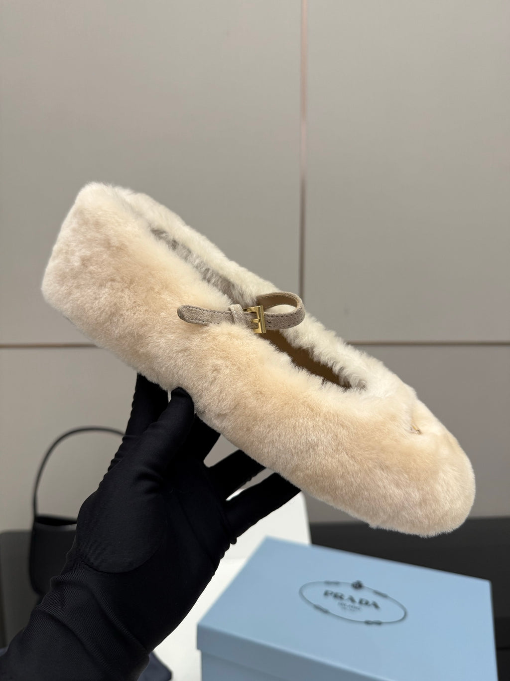Prada ladies shearling loafer, cream fuzzy upper with gold buckle strap detail