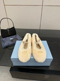 Prada ladies shearling loafers, cream fuzzy slip-ons with gold bow detail