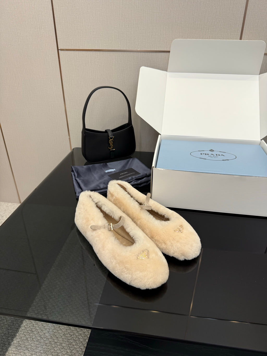 Prada ladies shearling loafers, cream plush slip-ons with gold top emblem detail