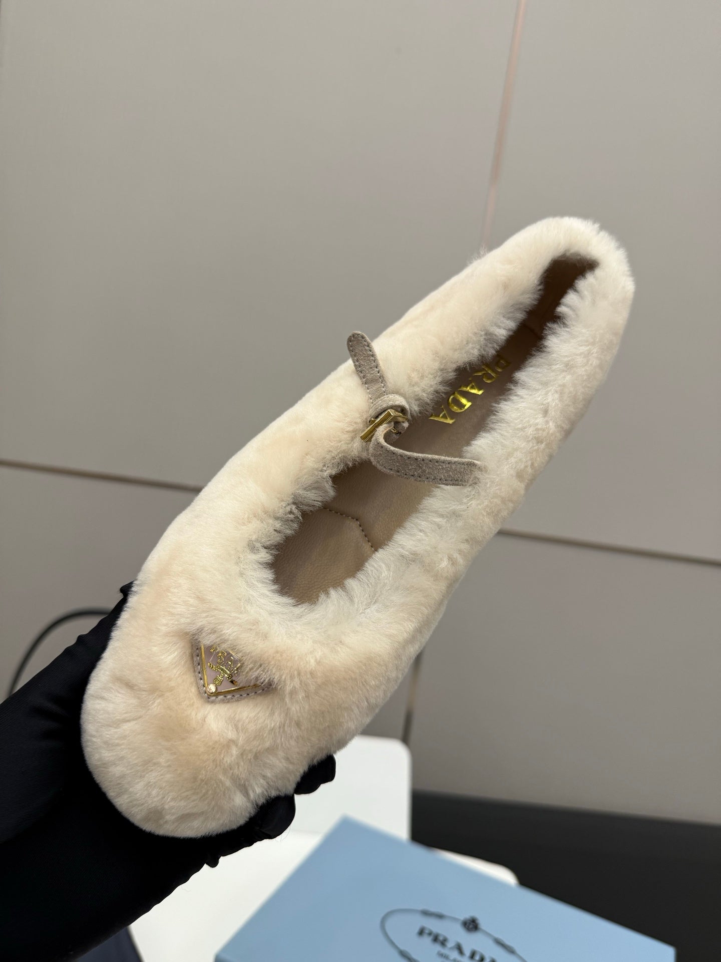 Prada ladies shearling loafer, cream open-top slip-on with gold logo hardware