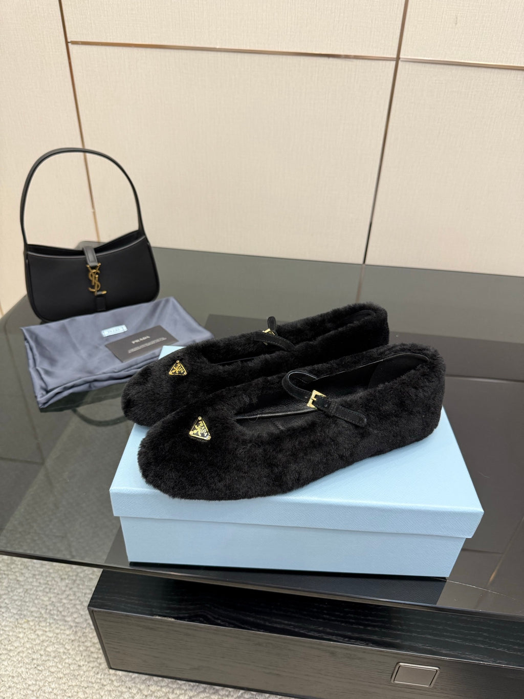 Prada women's black plush loafers, gold logo detail on upper, slip-on pair