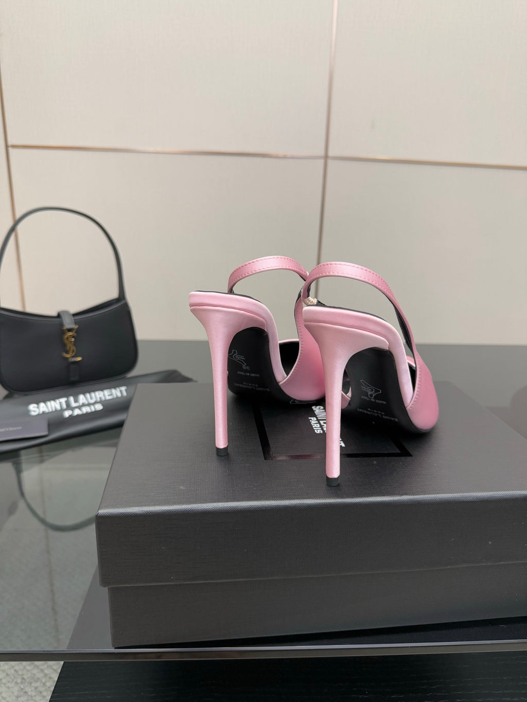 Pink pointed-toe stiletto heels, back view with ankle strap loops and slim heel