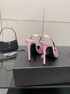 Pink pointed-toe stiletto heels, back view with ankle strap loops and slim heel