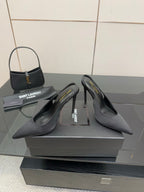 Women’s stiletto heeled pumps, dark leather, heel and toe view