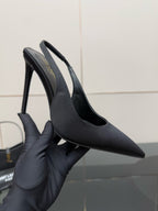 Women’s stiletto heeled pumps, dark leather, close-up toe and heel