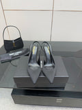 Women’s stiletto heeled pumps, dark leather, pointed toe