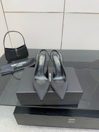 Women’s stiletto heeled pumps, dark leather, pointed toe