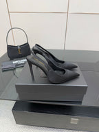 Women’s stiletto heeled pumps, dark leather, side profile