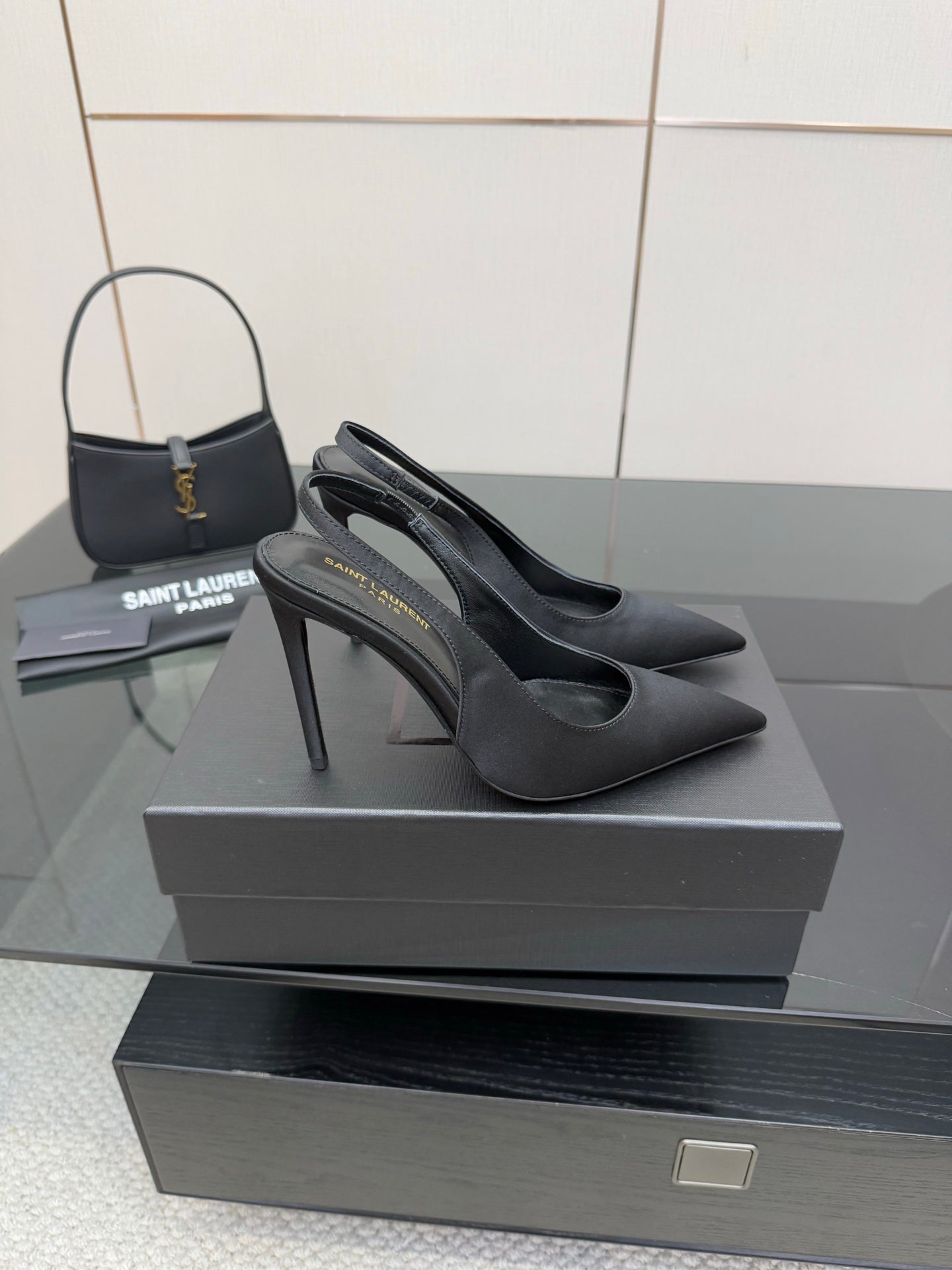 Women’s stiletto heeled pumps, dark leather, side profile