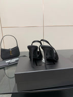 Women’s stiletto heeled pumps, dark leather, heels and back view