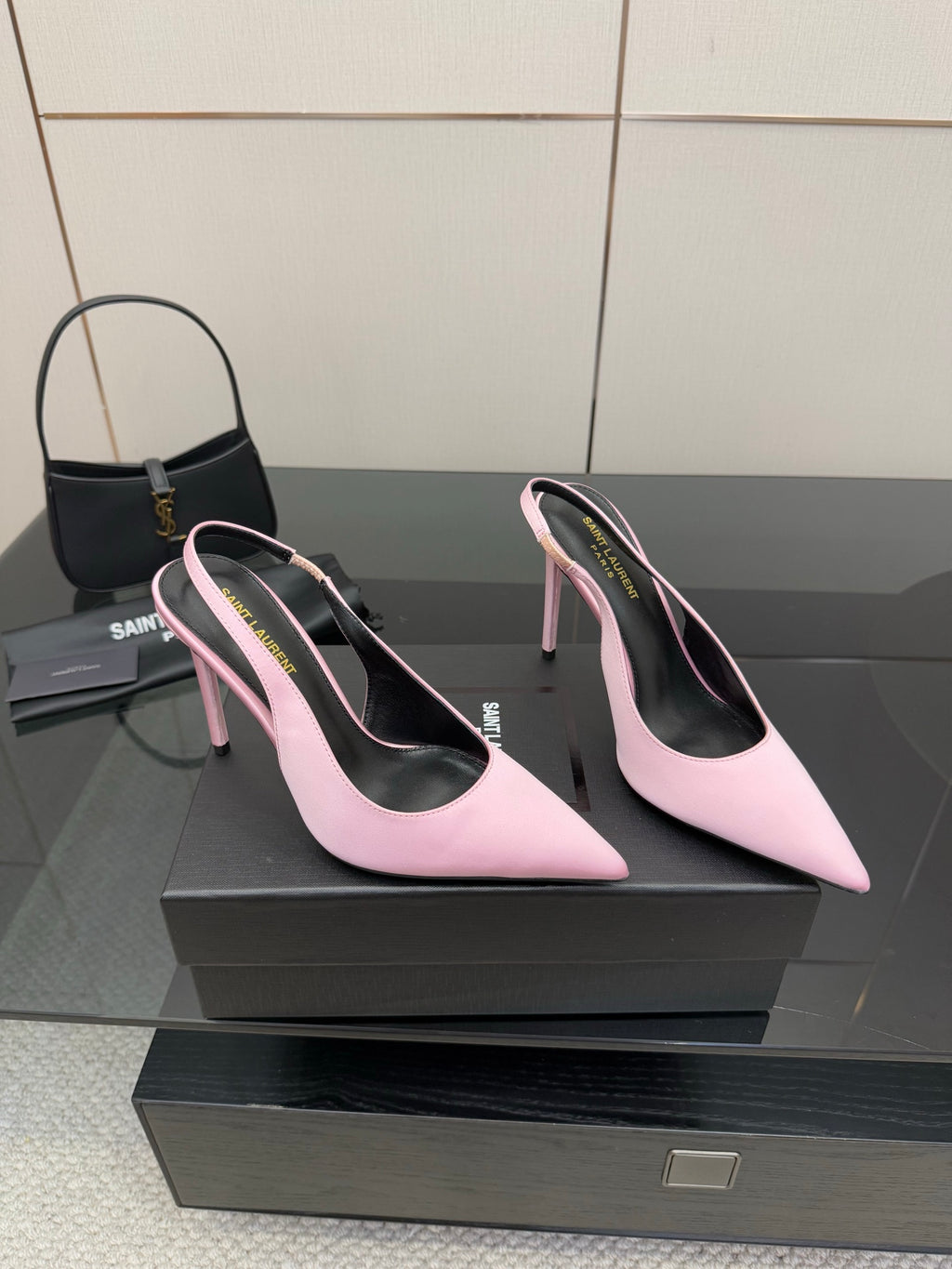 Pink pointed-toe stiletto heels, side view pair with narrow heel and curved toe