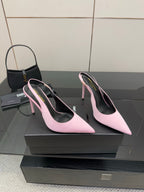 Pink pointed-toe stiletto heels, side view pair with narrow heel and curved toe