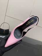 Pink pointed-toe stiletto heel, top view showing black insole with printed text