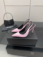 Pink pointed-toe stiletto heels, angled view showing slim high heel and black lining