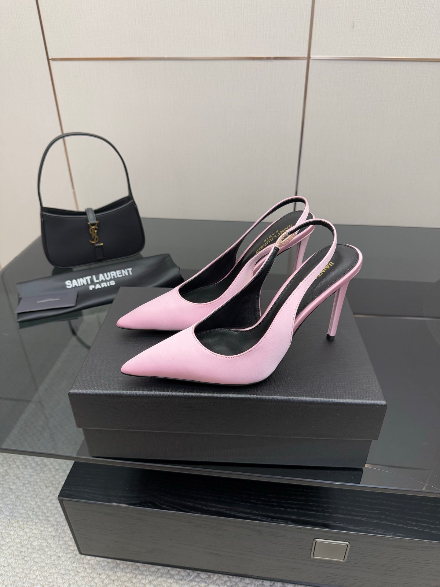 Pink pointed-toe stiletto heels, angled view showing slim high heel and black lining