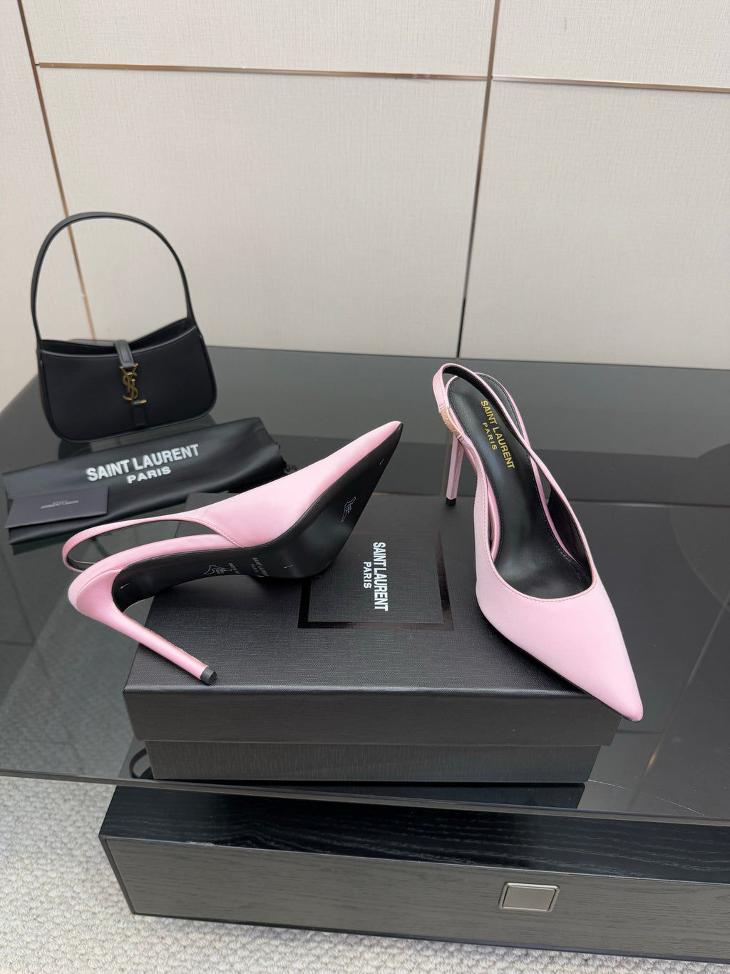 Pink pointed-toe stiletto heels, angled view showing outsole edge and stiletto heel
