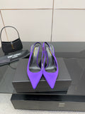 Purple pointed-toe stiletto pumps for women, shown as a pair on a display box.