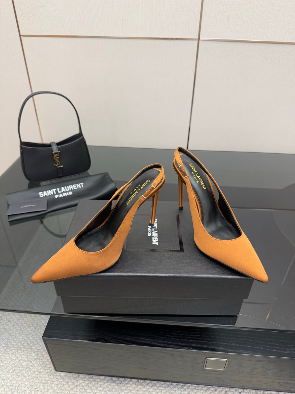 Orange pointed-toe high-heel pumps with stiletto heels and logo insole