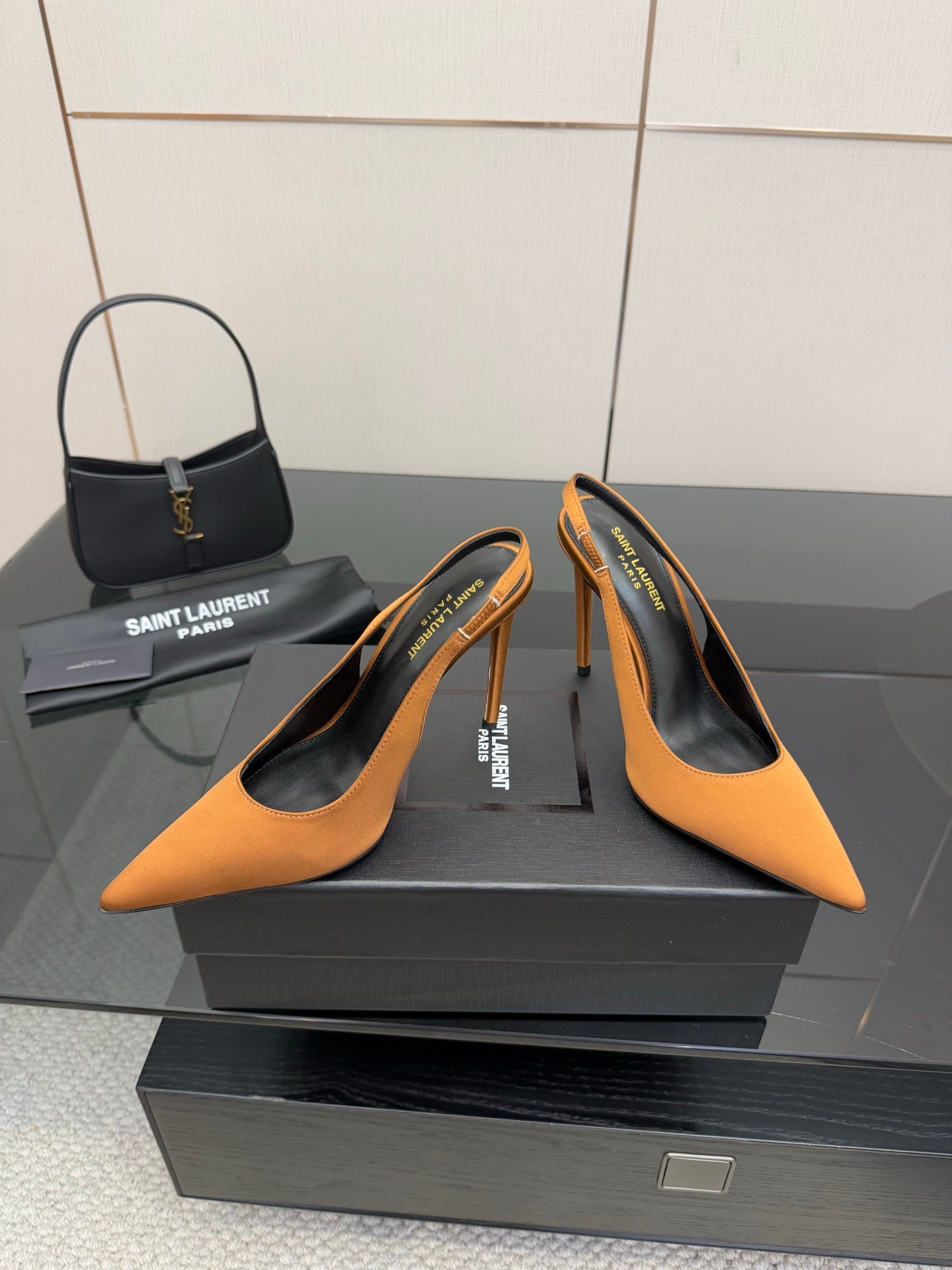 Orange pointed-toe high-heel pumps with stiletto heels and logo insole