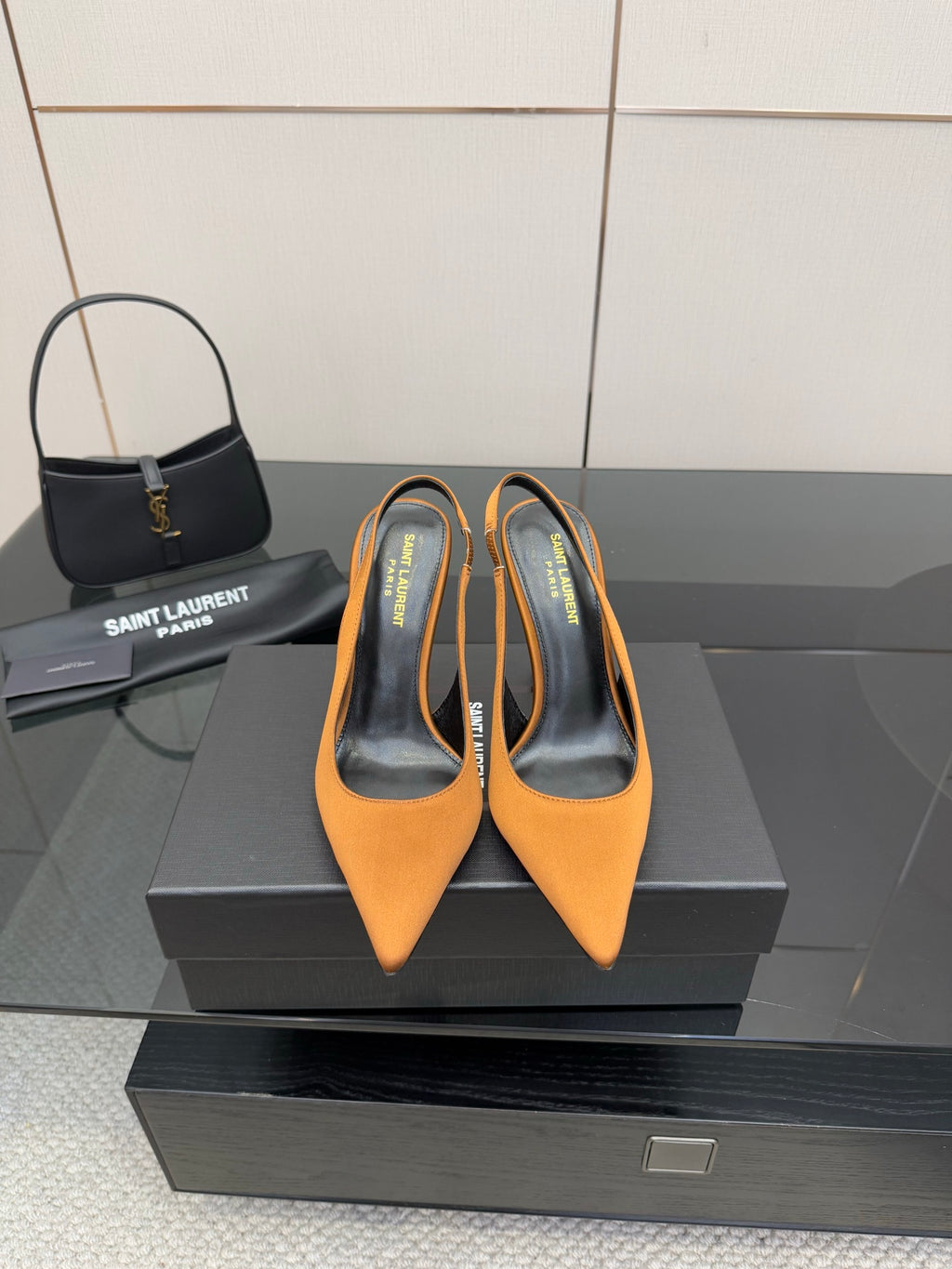 Orange pointed-toe high-heel pumps with stiletto heel and branded insole