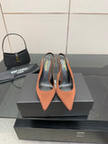 Two-tone pointed-toe slingback pumps with stiletto heel, brown and black upper