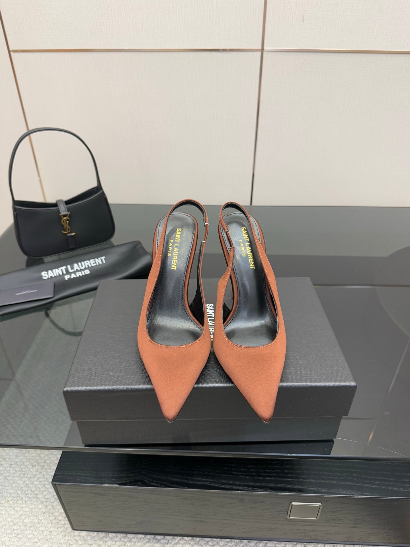 Two-tone pointed-toe slingback pumps with stiletto heel, brown and black upper