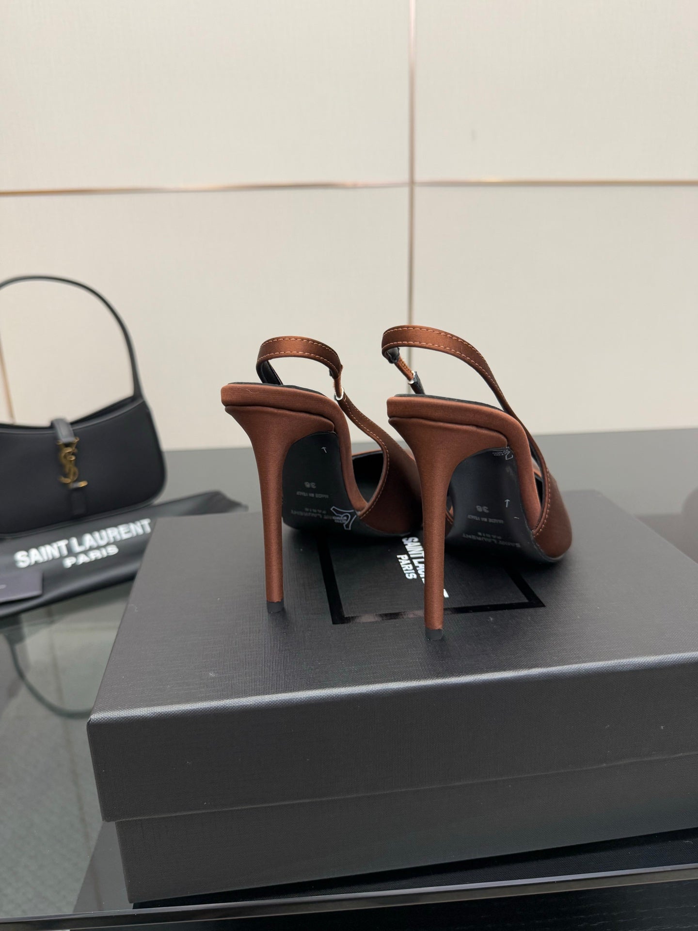 Two-tone slingback pumps with slim stiletto heels, brown and dark leather uppers