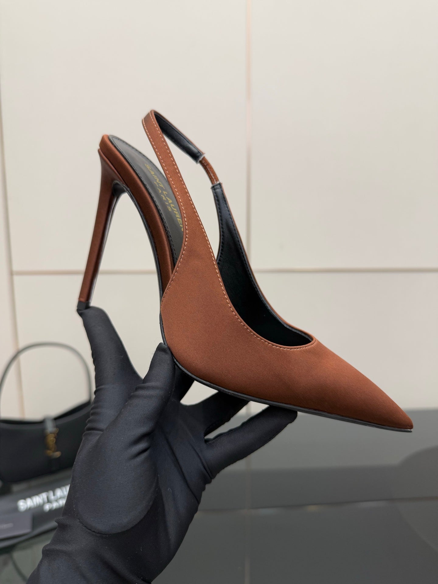 Two-tone pointed-toe slingback pump with high stiletto heel, brown and black leather