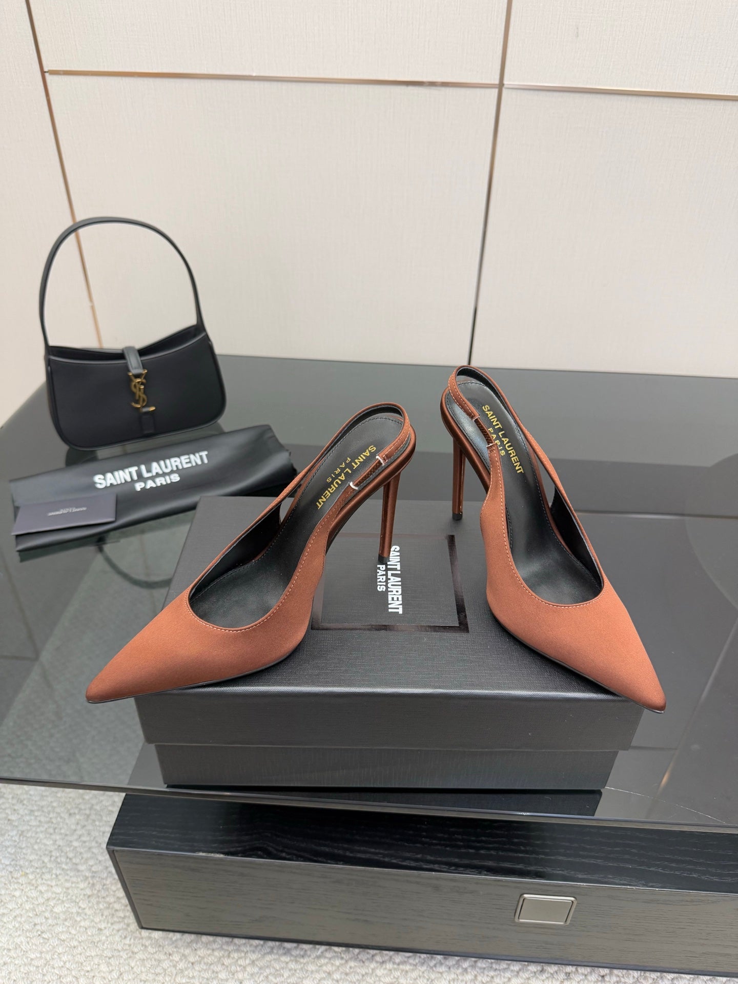 Two-tone pointed-toe slingback pumps with slim stiletto heels, brown and black
