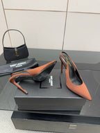 Two-tone pointed-toe slingback pumps with stiletto heel, brown upper and black trim