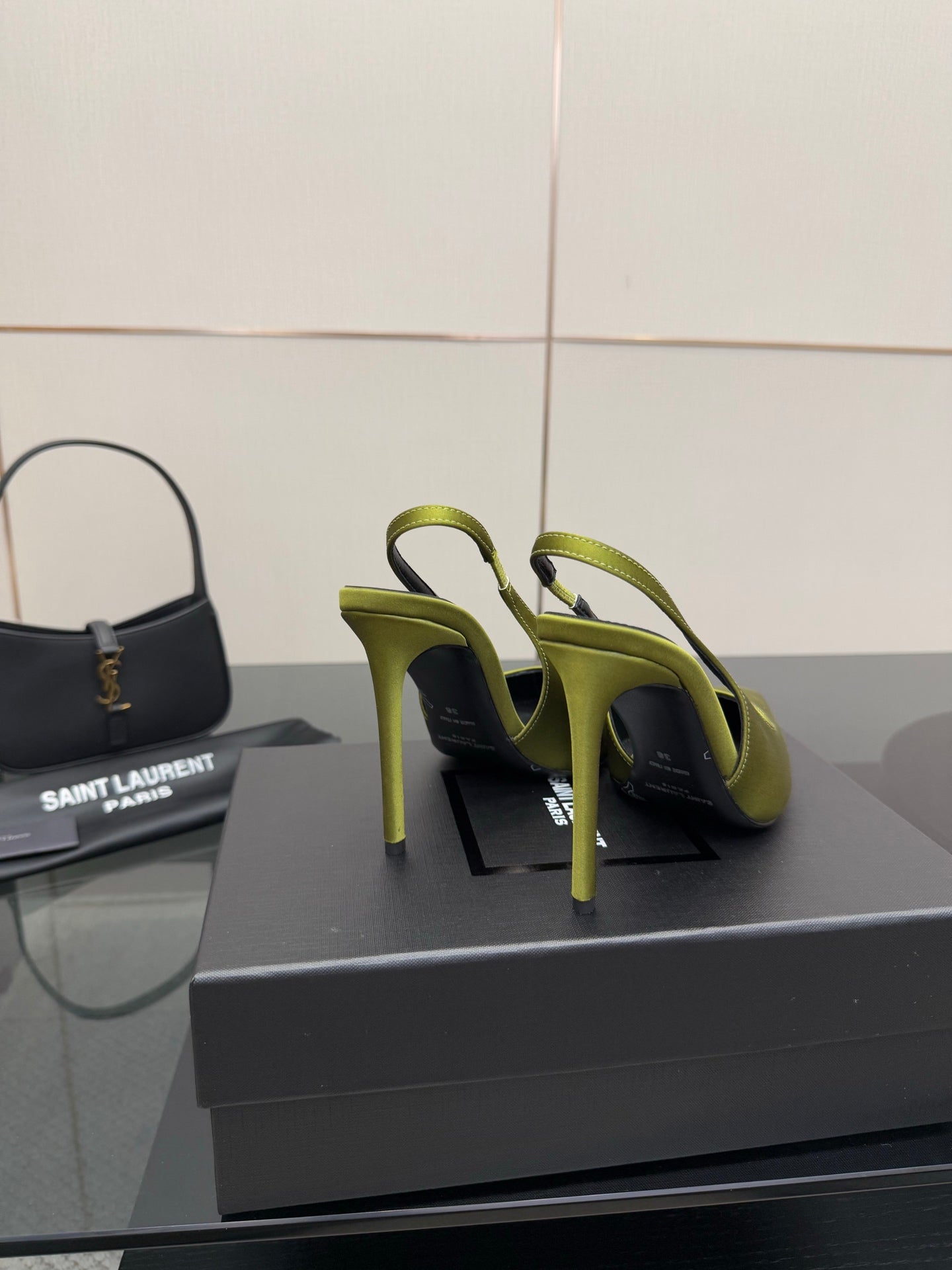 Ladies' lime green slingback stiletto pumps, side view on display