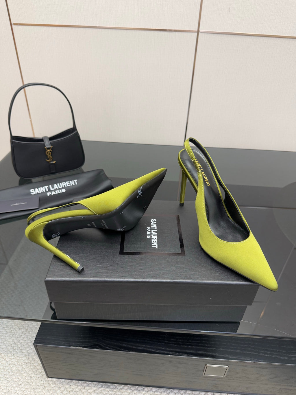Ladies' lime green slingback stiletto pumps, black heel interior visible