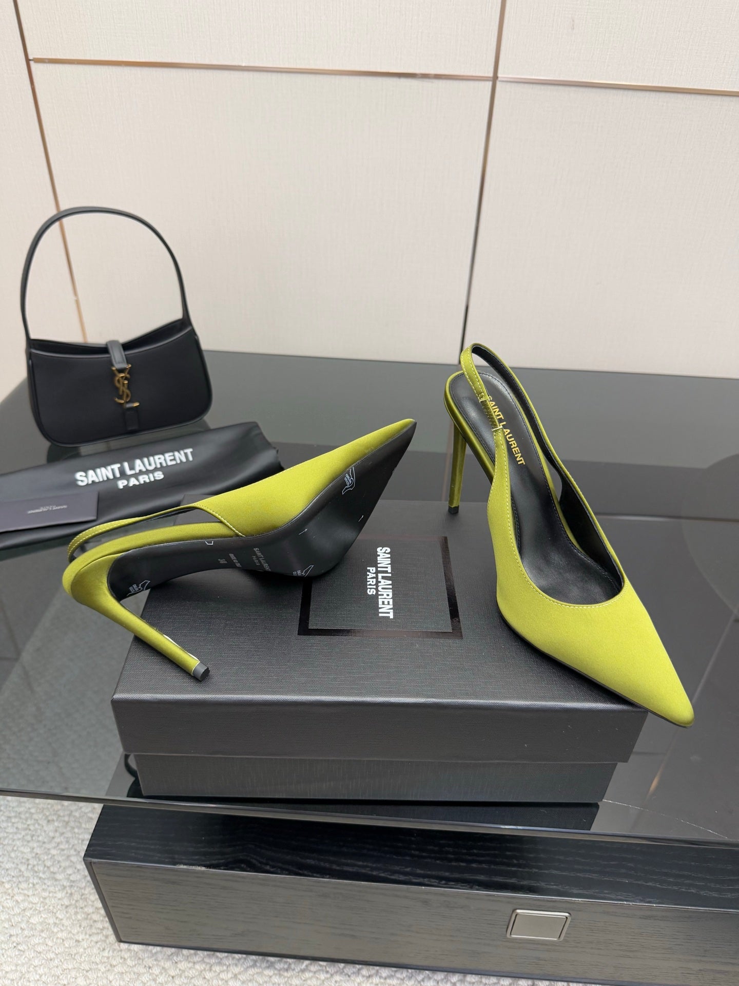Ladies' lime green slingback stiletto pumps, black heel interior visible