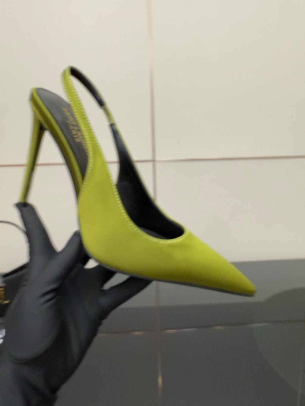 Ladies' lime green slingback stiletto pump close-up, pointed toe and heel