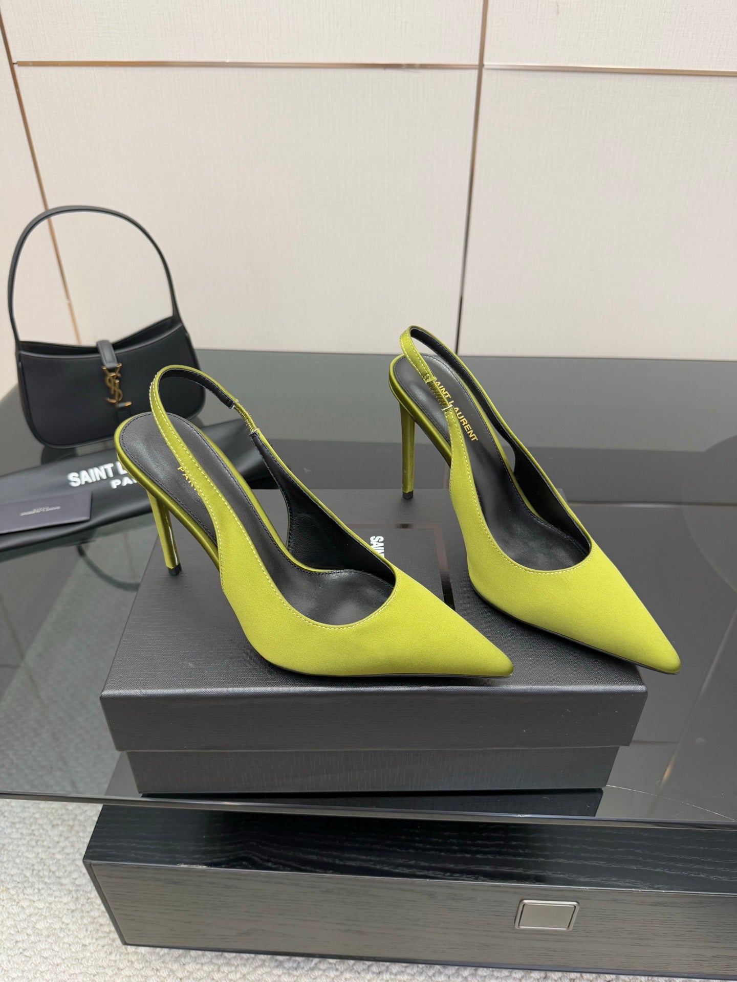 Ladies' lime green slingback stiletto pumps on display, pointed toe