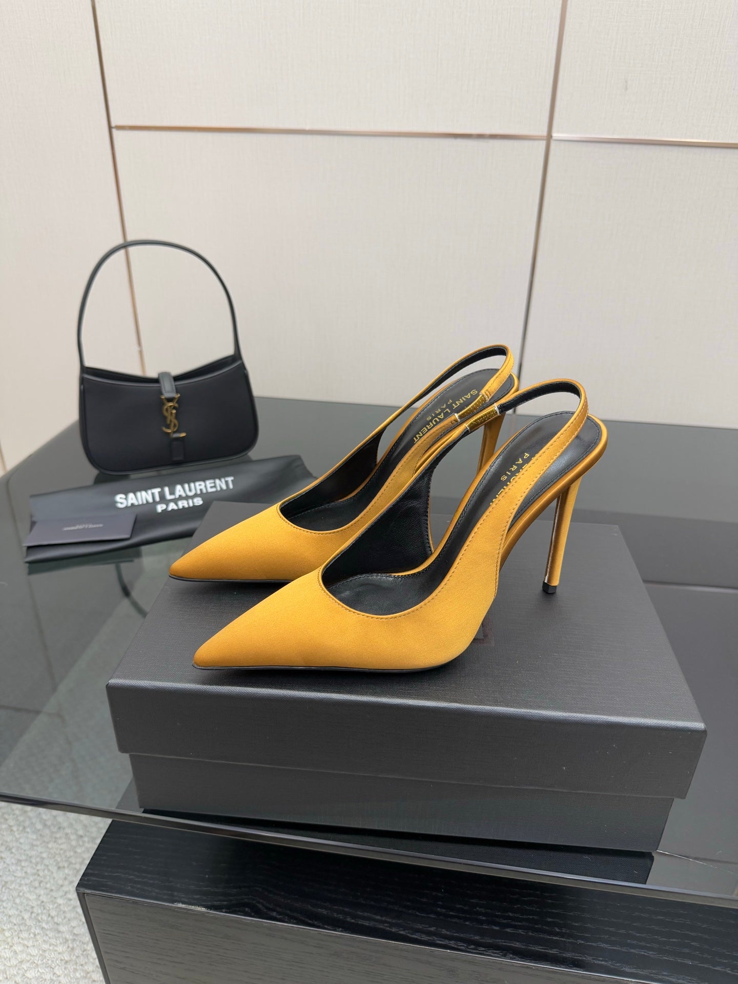 Yellow pointed-toe stiletto pumps with thin heel and black lining