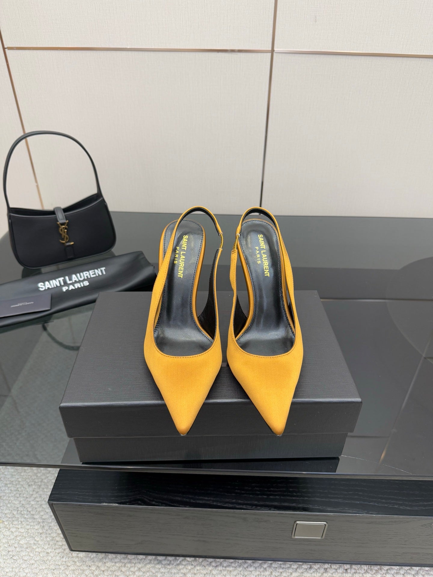 Yellow pointed-toe high-heel pumps with slim stiletto heels and slingback strap