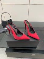 Ladies red high-heel pumps with pointed toes and stiletto heels, angled view