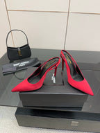 Ladies red pointed-toe stiletto pumps with black lining, heel and vamp detail