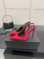 Ladies red pointed-toe stiletto pumps with black lining, side view