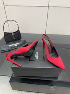 Ladies red high-heel pumps with pointed toe, thin stiletto heel, side profile