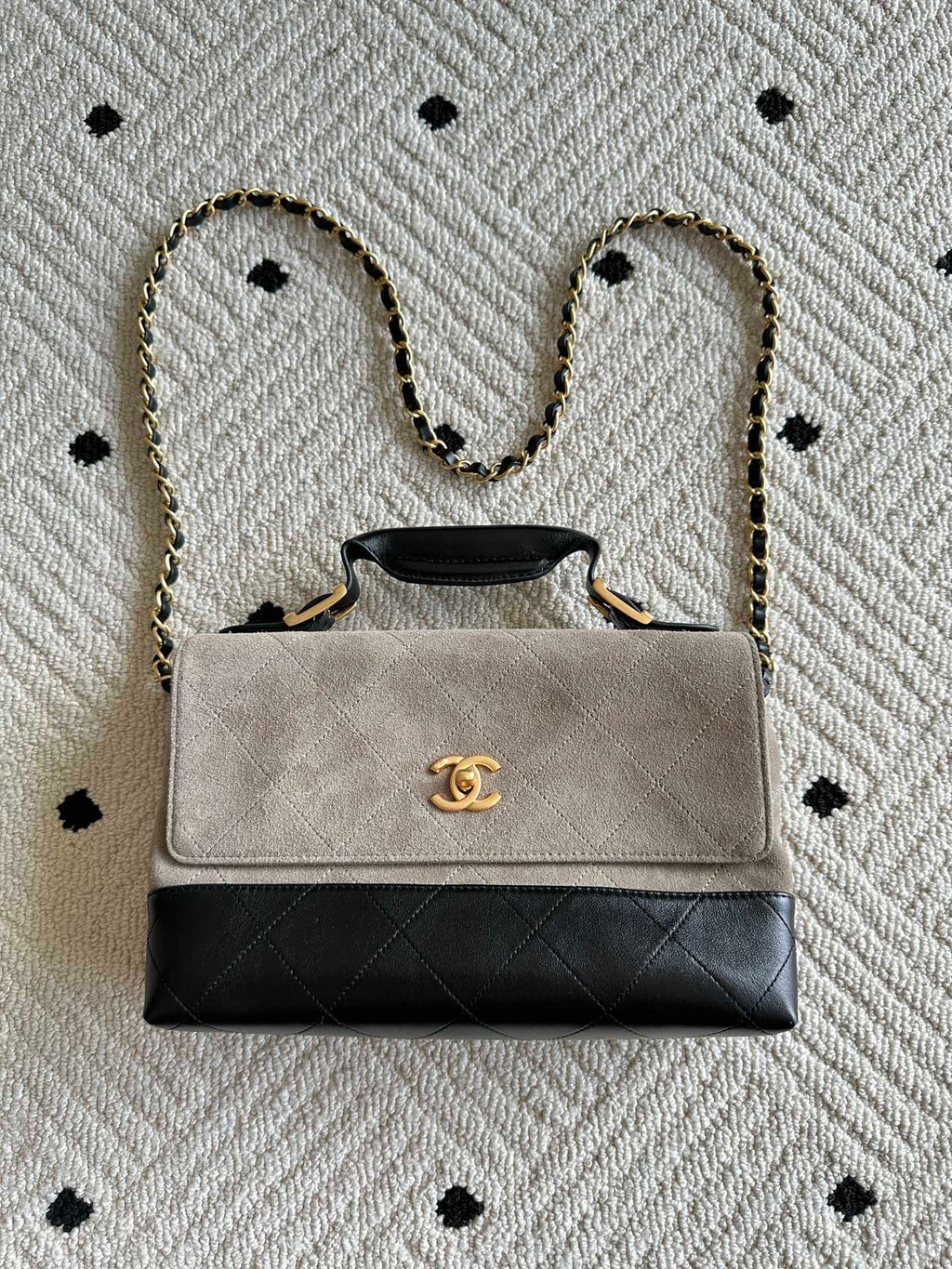 Chanel bag with chain strap, beige flap, black quilted base, gold CC clasp